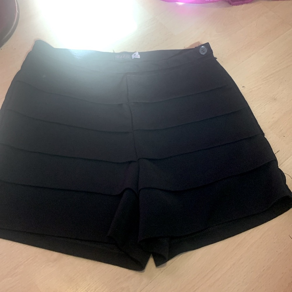 Elegant dress shorts size M(or5) like new. Frilly front, plain back. Zip up side
